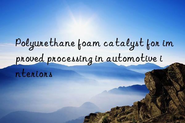 Polyurethane foam catalyst for improved processing in automotive interiors